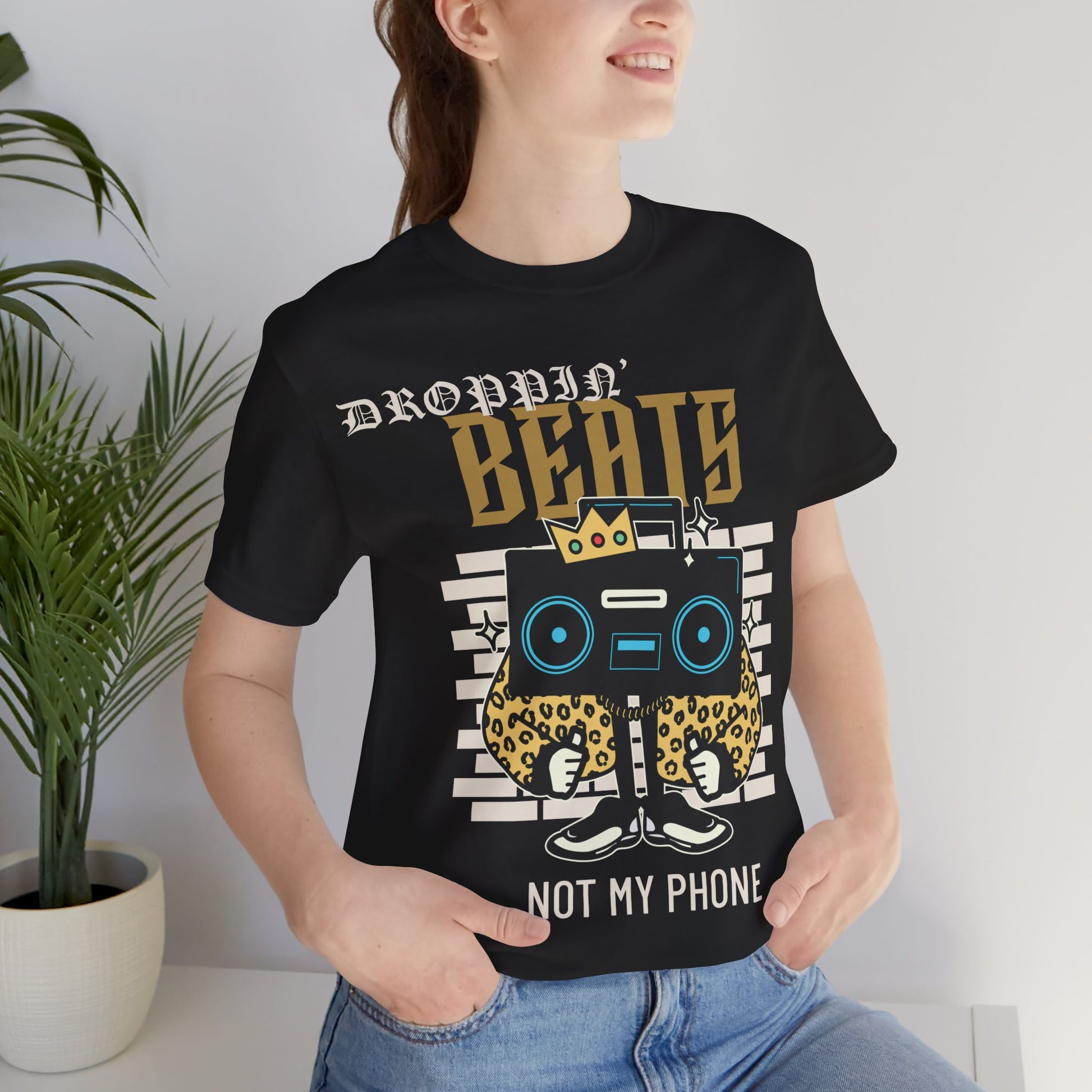 Droppin' Beats, Not My Phone Graphic Cotton T-Shirt - Trendy Short Sleeve Tee for Music Lovers | Unique Design, Comfortable Fit, Premium Quality Printify